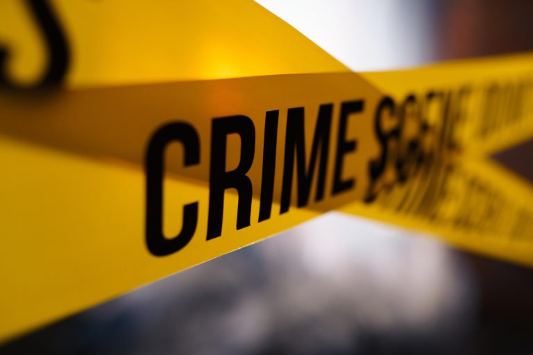 Barricade tape in close up on a blurred background