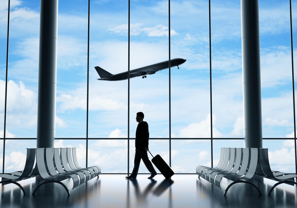 businessman in airport - HospitalityLawyer.com®