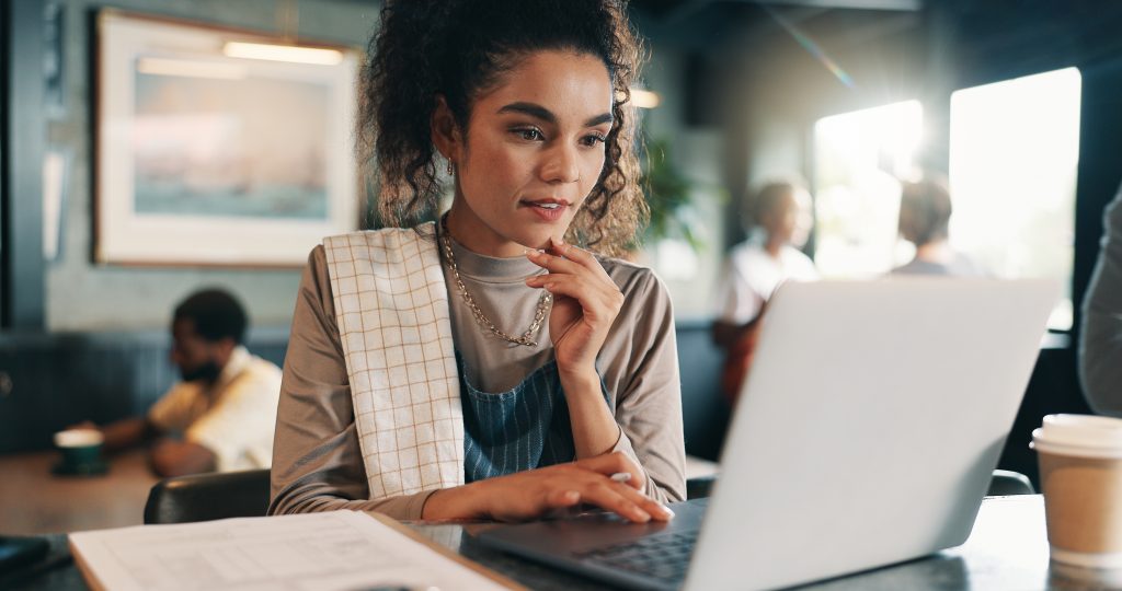 Business owner thinking and woman in restaurant laptop and problem solving for inventory Person employee or barista in coffee shop tech or online reading for review decision or report for sales - HospitalityLawyer.com®